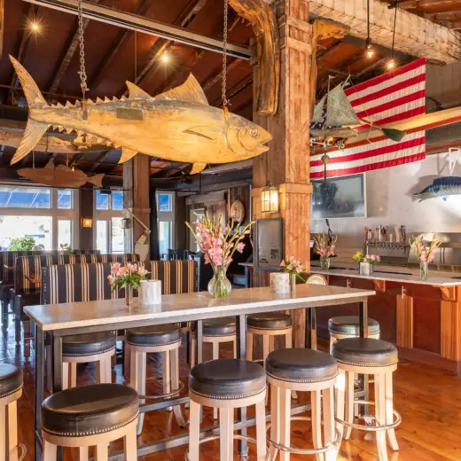 Dining room with tuna mount and high-top tables