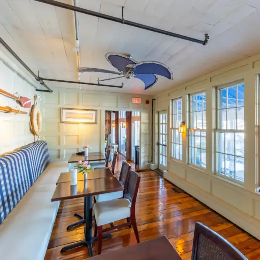 Sunny window dining room with banquettes