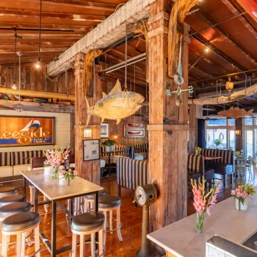 Rustic timber dining room with a mounted fish