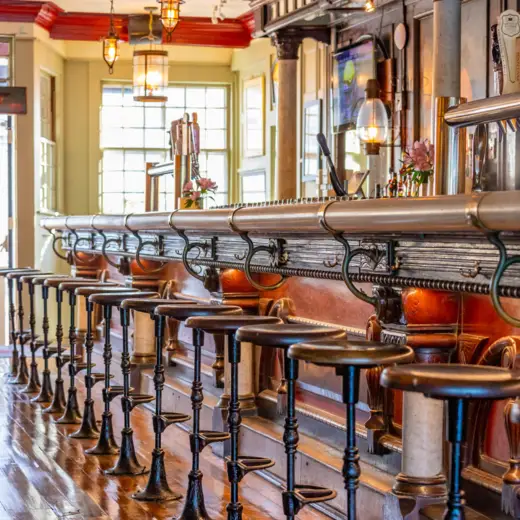 Bar with brass rail and stools